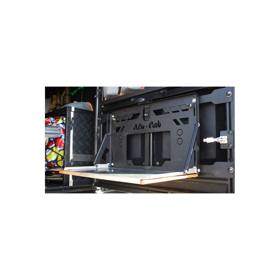 Improve your offroad experience with Alu-Cab folding table on the rear door of the Ineos Grenadier